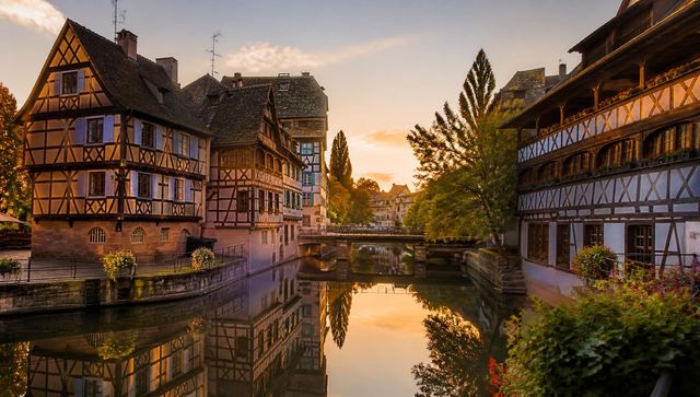 Surreal Strasbourg E-Bike Rental — The Petite France canals in Strasbourg at sunset, the starting point of every VéloRouge electric bike rental.